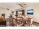 Formal dining area adjacent to the kitchen with a large table setting at 4024 W Griswold Rd, Phoenix, AZ 85051