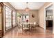 Inviting dining room with French doors and a stylish light fixture at 4024 W Griswold Rd, Phoenix, AZ 85051