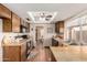 Bright kitchen with wood cabinets and a sunlit breakfast area overlooking the backyard at 4024 W Griswold Rd, Phoenix, AZ 85051
