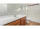 Well-lit bathroom features a single sink and a shower over bath combination at 41158 W Cahill Dr, Maricopa, AZ 85138