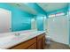 Bathroom with single sink, vanity and shower over bath combination at 41158 W Cahill Dr, Maricopa, AZ 85138