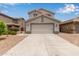 Charming two-story home with a neutral color scheme, tile roof, and a spacious two-car garage at 41158 W Cahill Dr, Maricopa, AZ 85138