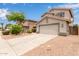 Attractive two-story home with a tile roof, desert landscaping, and convenient two-car garage at 41158 W Cahill Dr, Maricopa, AZ 85138