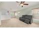 Bright loft space with carpet flooring, a ceiling fan, neutral walls, and lots of natural light at 41158 W Cahill Dr, Maricopa, AZ 85138