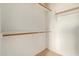 Walk-in closet with shelving and hanging rods for storage at 41158 W Cahill Dr, Maricopa, AZ 85138