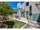 Lush backyard with desert landscaping, citrus trees, and a covered patio area at 4242 N 44Th St, Phoenix, AZ 85018