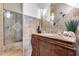 Elegant bathroom featuring a tiled shower and granite vanity with decorative accents at 4242 N 44Th St, Phoenix, AZ 85018