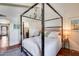 Inviting bedroom features a canopy bed, a patterned rug, and access to an en suite bathroom at 4242 N 44Th St, Phoenix, AZ 85018