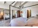 Spacious bedroom featuring a canopy bed, and entrances to a bathroom and a hallway at 4242 N 44Th St, Phoenix, AZ 85018