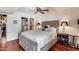 Relaxing bedroom showcasing hardwood floors, soft lighting, and a spacious layout at 4242 N 44Th St, Phoenix, AZ 85018