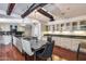 Open dining and kitchen area featuring a large island, modern lighting, and stainless appliances at 4242 N 44Th St, Phoenix, AZ 85018