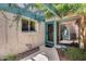 Charming front entrance showcasing a vibrant green door, unique window, and creeping vines adding natural beauty at 4242 N 44Th St, Phoenix, AZ 85018