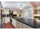 Bright kitchen featuring a large island, modern lighting, stainless appliances, and ample counter space at 4242 N 44Th St, Phoenix, AZ 85018
