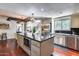 Bright kitchen boasts a large center island, stainless steel appliances, and open layout to living area at 4242 N 44Th St, Phoenix, AZ 85018