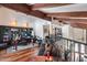 Open-concept living area with exposed wood beams, hardwood floors, and a view of the home's second level at 4242 N 44Th St, Phoenix, AZ 85018
