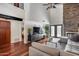 Open living area with views to the second level, wood floors, and a stone fireplace at 4242 N 44Th St, Phoenix, AZ 85018