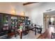 Home office with built-in shelving, hardwood floors, and a view to another living space at 4242 N 44Th St, Phoenix, AZ 85018