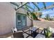 Inviting outdoor patio featuring stylish seating, tables, and a charming pergola with string lights and lush greenery at 4242 N 44Th St, Phoenix, AZ 85018