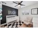 Charming Bedroom featuring a white crib, rocking chair, and decorative 'BRADY' wall art at 4320 N 35Th St, Phoenix, AZ 85018