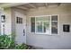 A charming front entry door featuring a modern design and a matching window at 4320 N 35Th St, Phoenix, AZ 85018