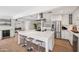 Contemporary kitchen boasting a large island with seating, a wine fridge, and modern appliances at 4320 N 35Th St, Phoenix, AZ 85018