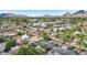 Beautiful aerial view of a neighborhood with lush greenery, palm trees and distant mountain views at 4320 N 35Th St, Phoenix, AZ 85018