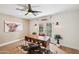 Stylish home office with natural light, a rustic desk, and views of the outdoor scenery at 4320 N 35Th St, Phoenix, AZ 85018