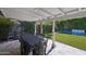 Charming covered patio with travertine tile, spiral staircase, and views of the backyard pool, great for relaxation at 4320 N 35Th St, Phoenix, AZ 85018