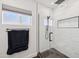 Modern glass shower with sleek black hardware, white subway tile, niche storage, and contemporary fixtures at 4320 N 35Th St, Phoenix, AZ 85018
