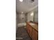 A bathroom with a shower and a vanity with tile flooring and granite countertops at 4704 E Paradise Village N Pkwy # 211, Phoenix, AZ 85032