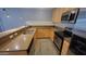 Modern kitchen featuring stainless steel appliances, stylish countertops, and ample storage at 4704 E Paradise Village N Pkwy # 211, Phoenix, AZ 85032