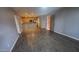 A spacious living room with hardwood floors extends into the kitchen with stainless steel appliances at 4704 E Paradise Village N Pkwy # 211, Phoenix, AZ 85032