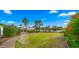 Spacious backyard featuring a lush lawn, blooming flowers, and ample space for outdoor activities at 4824 E Hummingbird Ln, Paradise Valley, AZ 85253