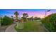 Lush backyard with a sports area, featuring well-maintained grass and mature trees, perfect for outdoor activities at 4824 E Hummingbird Ln, Paradise Valley, AZ 85253