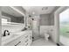 Bright bathroom features double vanity, tiled floors, glass shower, and modern finishes at 4824 E Hummingbird Ln, Paradise Valley, AZ 85253