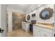 Bathroom with double sinks, granite countertop, and glass shower stall at 4824 E Hummingbird Ln, Paradise Valley, AZ 85253