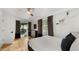 Bright bedroom with hardwood floors, natural light, and patio access at 4824 E Hummingbird Ln, Paradise Valley, AZ 85253