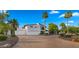 Elegant white stucco home with a spacious three-car garage and a paved driveway at 4824 E Hummingbird Ln, Paradise Valley, AZ 85253