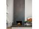 Modern fireplace with dark tile extending to the ceiling at 4824 E Hummingbird Ln, Paradise Valley, AZ 85253