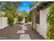 Charming front yard with a stone pathway, lush landscaping, and inviting entrance at 4824 E Hummingbird Ln, Paradise Valley, AZ 85253