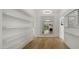 Hallway with a large mirror and wood floors at 4824 E Hummingbird Ln, Paradise Valley, AZ 85253