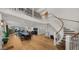 Expansive living area featuring hardwood floors, a grand staircase, and an open floor plan for modern living at 4824 E Hummingbird Ln, Paradise Valley, AZ 85253