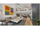 Spacious living room with modern decor, fireplace, and views to a second-story balcony at 4824 E Hummingbird Ln, Paradise Valley, AZ 85253