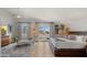 Bright main bedroom with a cozy chaise lounge, hardwood floors, and private access to a patio at 4824 E Hummingbird Ln, Paradise Valley, AZ 85253