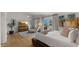 Bright main bedroom featuring a mounted television, hardwood floors, and an exterior view at 4824 E Hummingbird Ln, Paradise Valley, AZ 85253