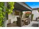 Inviting outdoor patio with pergola, dining area, and built-in grill perfect for entertaining at 4824 E Hummingbird Ln, Paradise Valley, AZ 85253