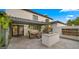 Covered patio features an outdoor kitchen, dining space, and landscaped backyard at 4824 E Hummingbird Ln, Paradise Valley, AZ 85253