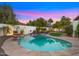 Beautiful pool with stone surround and lush landscaping, perfect for relaxation and entertaining at 4824 E Hummingbird Ln, Paradise Valley, AZ 85253