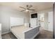 Bedroom features neutral carpet, ceiling fan, and ensuite bathroom at 520 N Stapley Dr # 117, Mesa, AZ 85203
