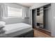Comfortable bedroom features a built-in closet organizer for efficient storage at 520 N Stapley Dr # 117, Mesa, AZ 85203